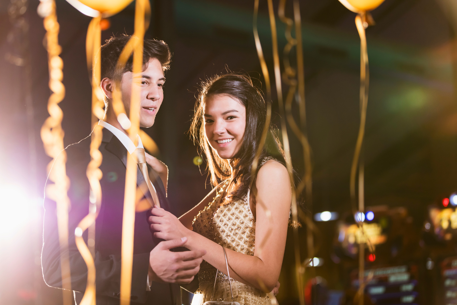 Teenage couple having fun at prom